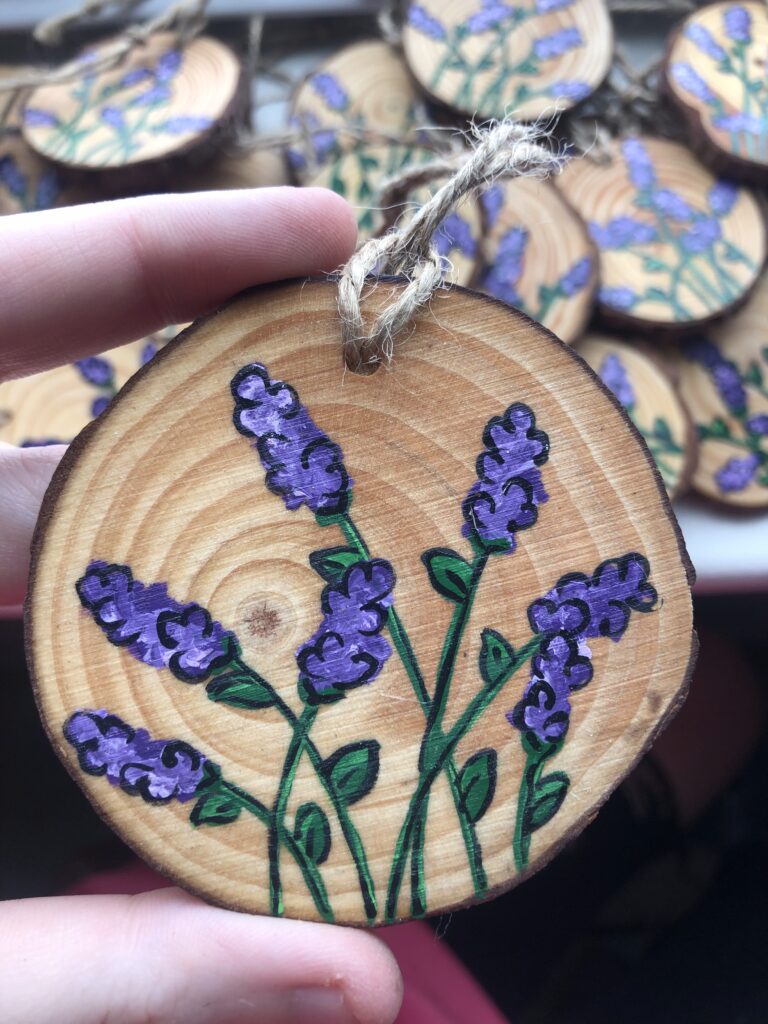 Hand painted lavender wood slice ornament.
